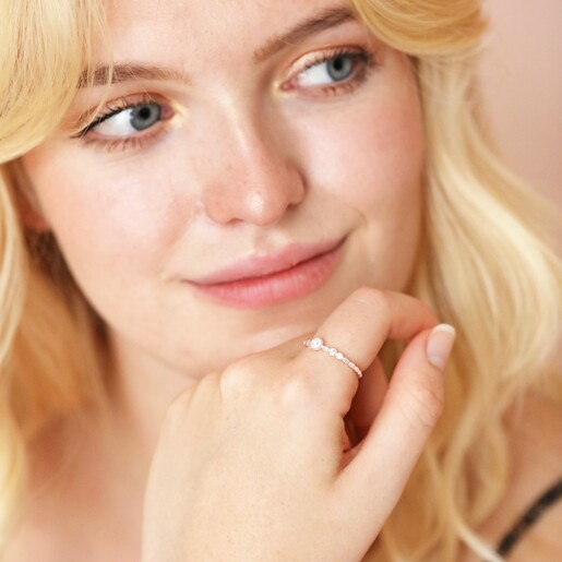 Ring on Model Dainty Pearl and Crystal Stacking Ring in Silver on model with hand under chin