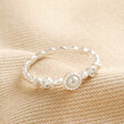 Dainty Pearl and Crystal Stacking Ring in Silver on top of neutral coloured fabric