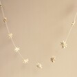 Afroart Natural Stars on a String Garland in front of neutral background