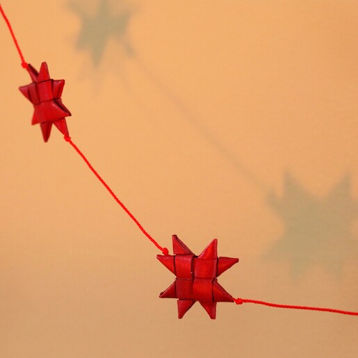 Close up of stars on Afroart Red Stars on a String Garland