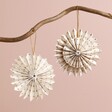 Afroart Set of 2 White and Gold Layered Pinwheel Hanging Decorations hanging from neutral coloured background with one facing forwards and one facing backwards