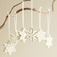 Afroart Set of 6 Quilled Star Hanging Decorations hanging from tree branch against neutral background