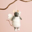 Felt Angel Mouse Hanging Decoration on Branch Against Pink Background