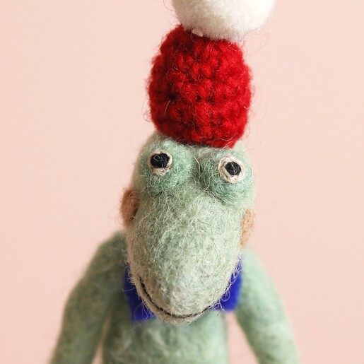 Felt Christmas Crocodile Hanging Decoration on Pink Background