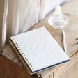 Blue Starry Night Lined Notebook open on top of wooden surface 