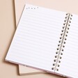 Pink Cat Lined Notebook open on blank page on top of neutral surface