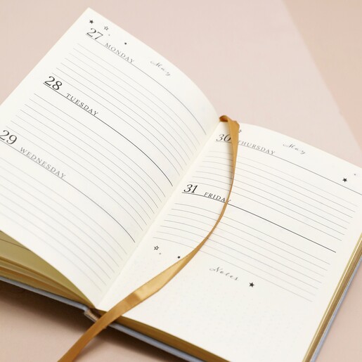 Dusky Blue 2024 Diary open showing notes underneath days of the month