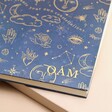 Close up of personalisation on Personalised Initials Blue Starry Night Lined Notebook