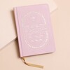 Pink Sun and Moon Fabric Notebook on top of beige coloured surface