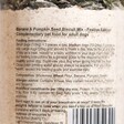 Back of Doggy Baking Co. Banana and Pumpkin Seed Biscuit Mix bottle showing feeding instructions and ingredients