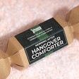 Birdseye view of Green Cuisine Hangover Comforter Christmas Cracker on top of fake snow