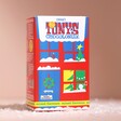 Tony's Chocolonely Tiny Tony's Christmas Gift Box in front of neutral background with fake snow