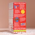 Side of Tony's Chocolonely Tiny Tony's Christmas Gift Box showing Tony's Chocolonely's mission