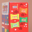 Side of Tony's Chocolonely Tiny Tony's Christmas Gift Box packaging showing different chocolate flavours