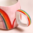 Close Up of House of Disaster Overwhelmed Rainbow Mug Handle