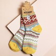 House of Disaster Moomin Fair Isle Moomin Socks on Beige Surface 