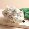 Close up of hedgehog from House of Disaster Secret Garden Hedgehog Hot Water Bottle out of hot water bottle cover