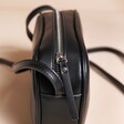 Close up of zip on Rectangular Crossbody Bag in Black 