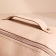 Close up of handle on Rectangular Makeup Bag in Pink