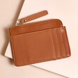 Vegan Leather Card Holder in Tan on Beige Surface