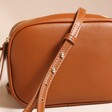 Close up of strap on Rectangular Crossbody Bag in Tan 