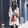 Model wearing Rectangular Crossbody Bag in Tan with abstract winter scarf walking down street