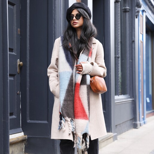 Bag on Model Model wearing Rectangular Crossbody Bag in Tan with abstract winter scarf walking down street