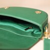 Interior of Vegan Leather Half Moon Crossbody Bag in Green on Beige Background 