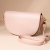 Vegan Leather Half Moon Crossbody Bag in Pink on Beige Background