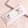 Lisa Angel Mulled Wine Soy Wax Melts inside of packaging on beige backdrop with fake snow