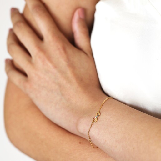 Estella Bartlett Multicoloured Crystal Infinity Bracelet In Gold on Model