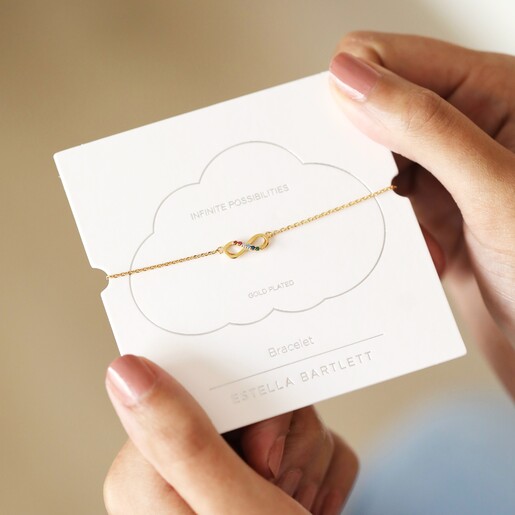 Estella Bartlett Multicoloured Crystal Infinity Bracelet In Gold on Packaging 