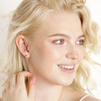 Blonde model wearing the Estella Bartlett Asymmetric Multicolour Crystal Stud Earrings