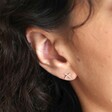 Close Up of Estella Bartlett Kiss Stud Earrings In Silver on Model