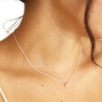 Close Up Estella Bartlett Kiss Pendant Necklace in Silver on Model