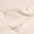 Full Picture of Estella Bartlett Knot Pendant Necklace In Gold