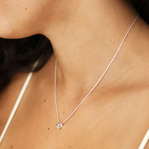  Close Up of Estella Bartlett Knot Pendant Necklace In Silver on Model