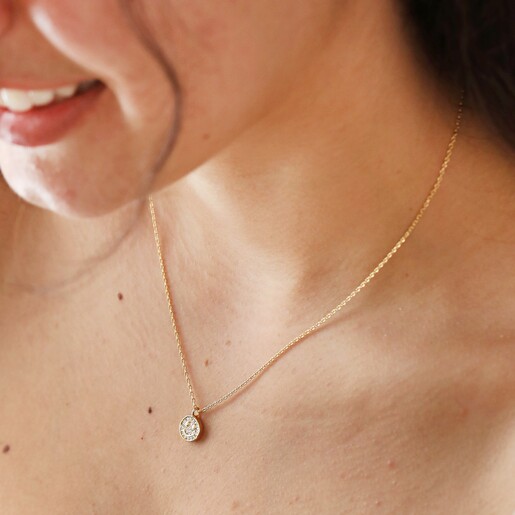 Close Up of Estella Bartlett Pavé Smiley Pendant Necklace Gold on Model