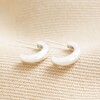 Sterling Silver Chunky Hoop Earrings on Beige Fabric