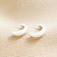 Sterling Silver Chunky Hoop Earrings on Beige Fabric