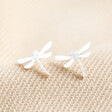 Sterling Silver Dragonfly Stud Earrings on Beige Fabric