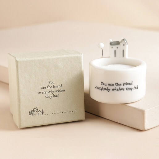 East of India Friend Tealight Holder with gift box to the side in front of neutral coloured backdrop