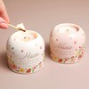 Model lighting tealight in Mum candle holder next to Nana Meaningful Word Candle Holder