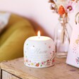 Mum Meaningful Word Candle Holder on top of wooden counter with vase in backdrop