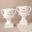Personalised Ceramic Speckled Trophies on Beige Surface 