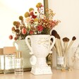 Star Sign Ceramic Speckled Trophy with flowers inside in lifestyle shot