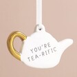 Close Up of You're Tea-rific Teapot Hanging Decoration on Pink Background 