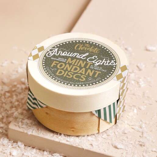 The Chocolate Gift Company Dark Chocolate Mint Fondant Disc Box on top of beige coloured surface with fake snow