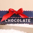 Side of The Chocolate Gift Company Hollow Milk Chocolate Santa close up of red bow
