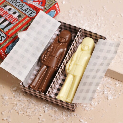 The Chocolate Gift Company Chocolate Toy Soldiers packaging open on top of neutral surface with fake snow